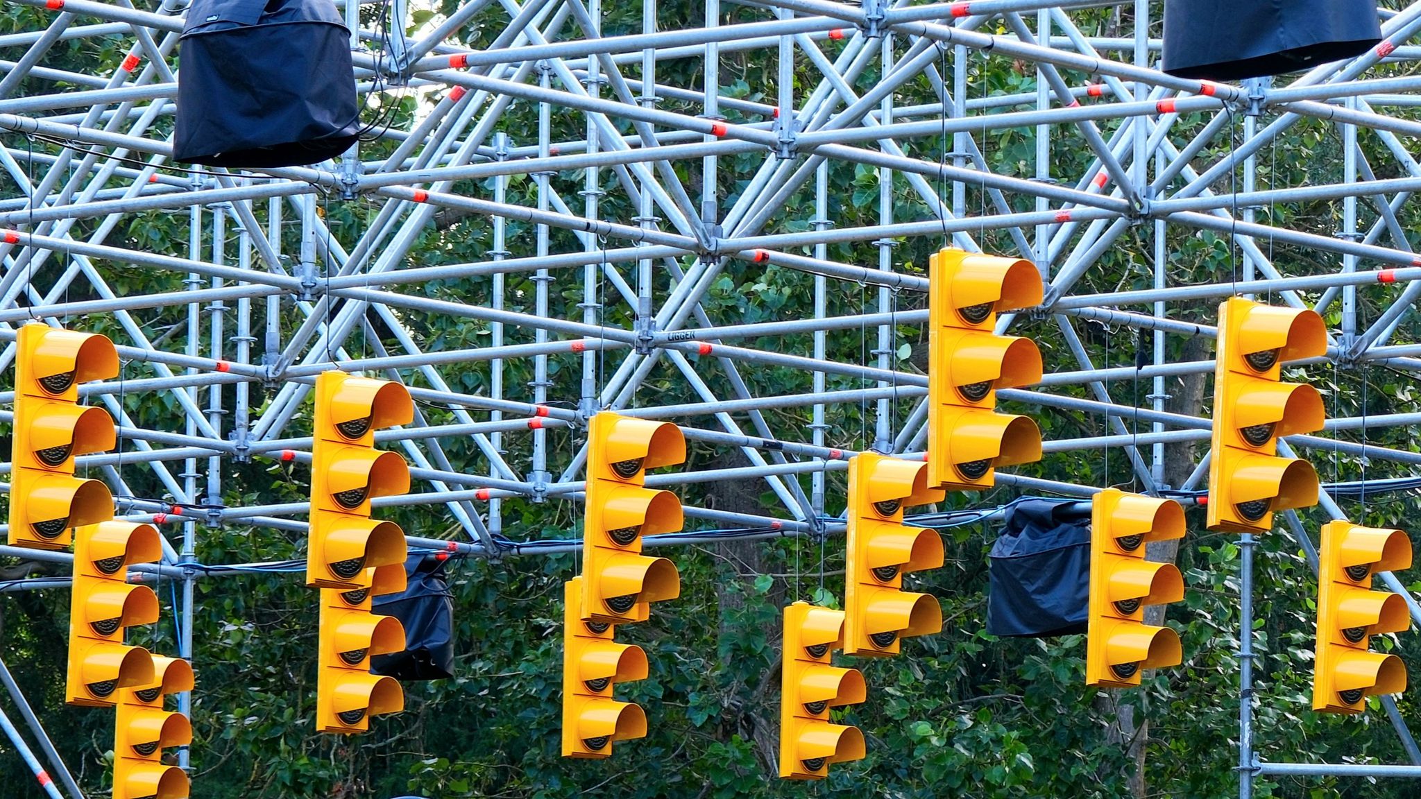 A lot of yellow traffic lights