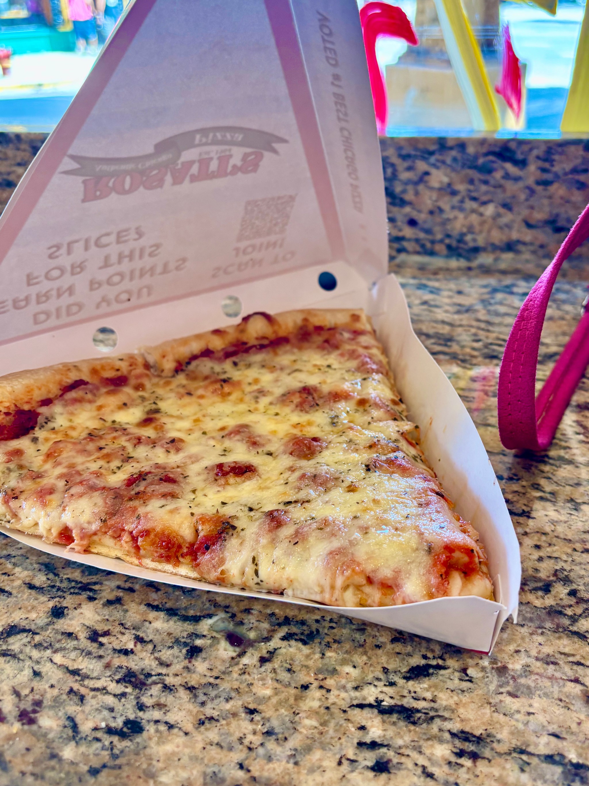 Just another city girl grabbing a slice at the neighborhood place.
